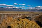 USA, New Mexico, Rio Grande del Norte NM. Rio Grande Gorge Bridge and snow-covered peaks. Art Print